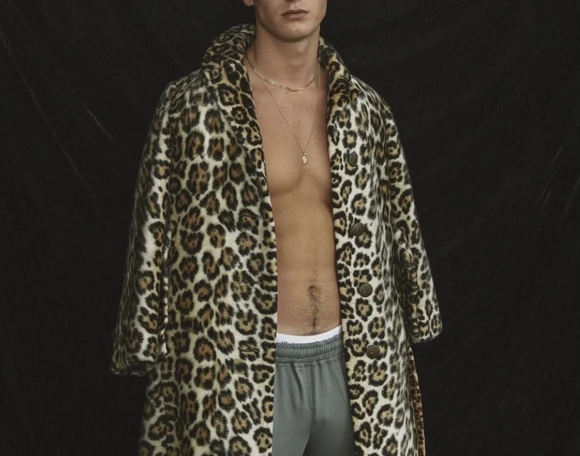 Fashion editorial portrait featuring a leopard-pattern coat.